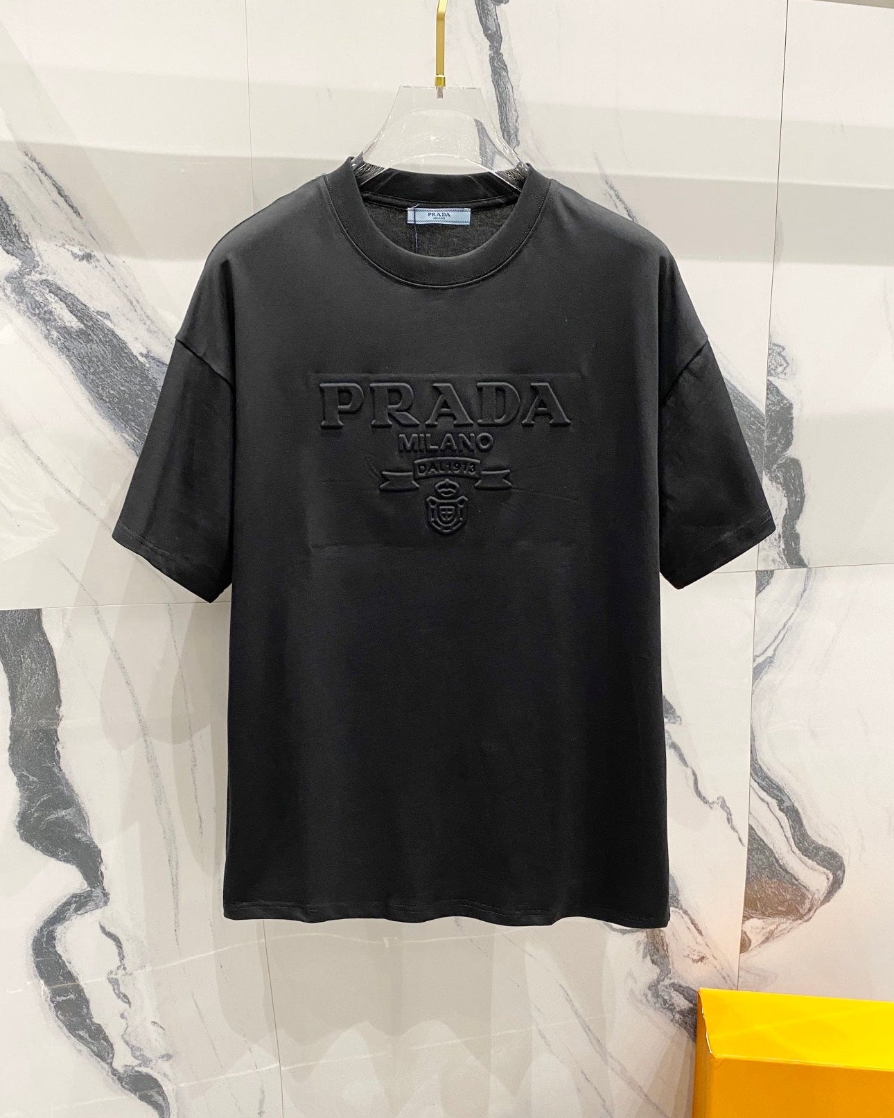 Three-dimensional embossed letter T-shirt